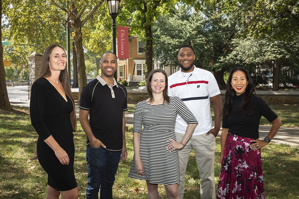 Dickinson's Student Success and Academic Advising Staff pose for a photo outside