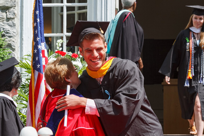 Members of the class of 2018 descend the "old stone steps" as the officially become graduates of the college. Photo by Carl Socolow '77.