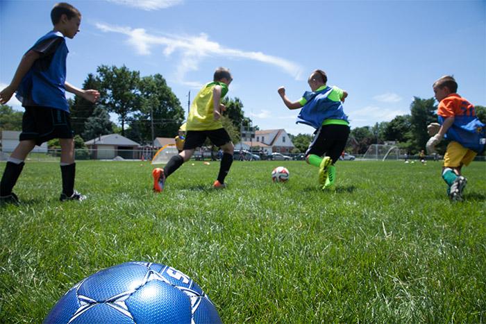 Soccer camp participants take to the field.