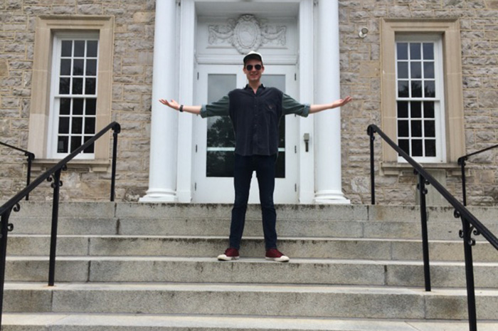 Taylor Hunkins '17 on the steps of The Trout Gallery, where he works as an education intern.