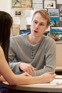 Two students work on an essay.