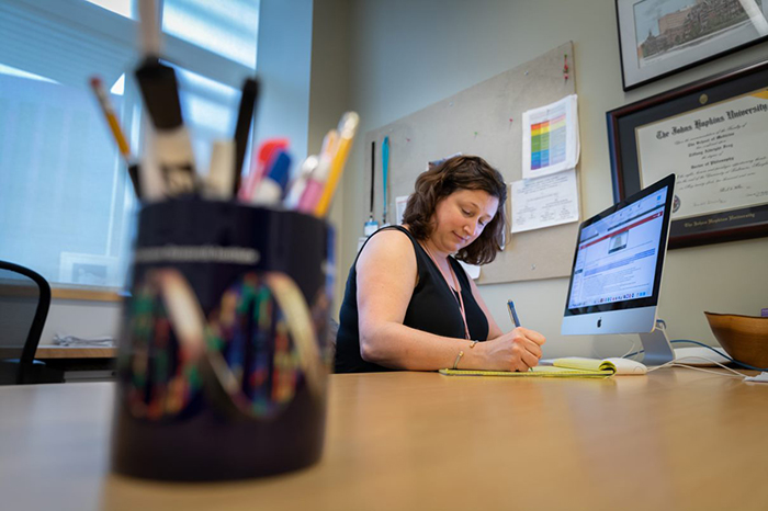 Associate Professor of Biology Tiffany Frey prepares online-learning classes for the fall semester. Photo by Joe O'Neill.