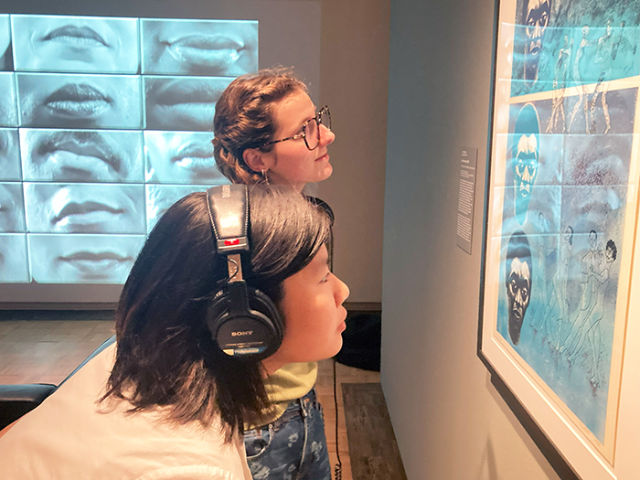 Headphones are provided to listen to Zuzu Black's original compositions. Photo provided by The Trout Gallery.