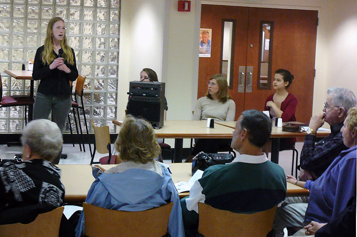 Svenja Schneider '13 delivers part of a group presentation to regional physicians while co-researchers and fellow class of 2013 members (seated, from left) Christine Talbot, Tracy Campbell and Laura Schorfheide look on.